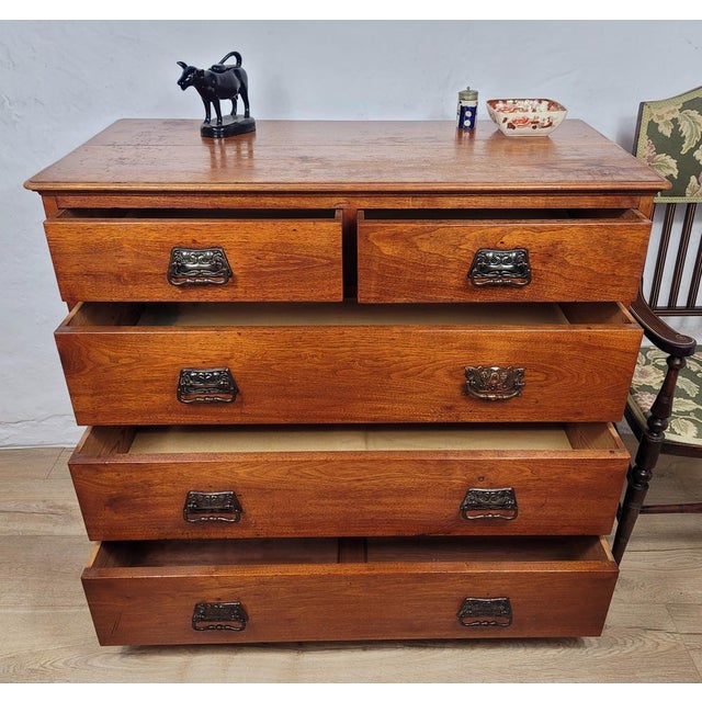 This is a gorgeous Arts and Crafts 1910's pine chest of drawers, with exquisite features that would grace a vintage home...