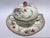 This is a small Meissen masterpiece of craftsmanship: the fine porcelain is designed with floral and natural scenes, rich...
