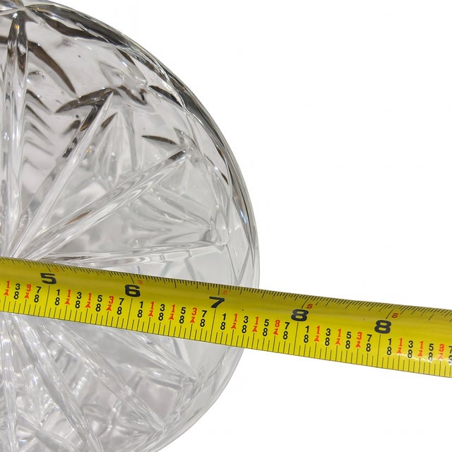 Refined and timeless, this pair of vintage cut glass ship decanters features classic wide bases and slender necks — a...