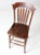 This is an antique Sheboygan Chair Company chair. The richly toned lathe-back chair has a high seat with turned legs and...