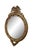 Antique gold giltwood convex bullseye wall mirror featuring a round frame varved with and American eagle with wings...