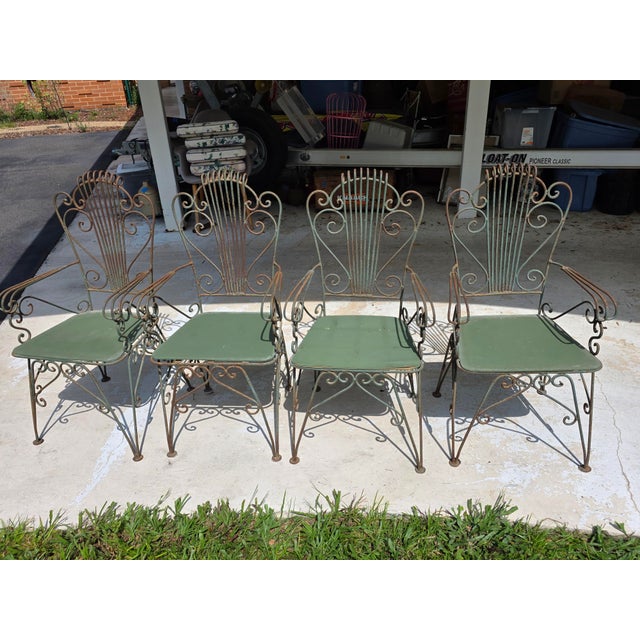 This listing consists of a beautiful vintage set of 4 neoclassical style green wrought iron lyre harp garden chairs.They...
