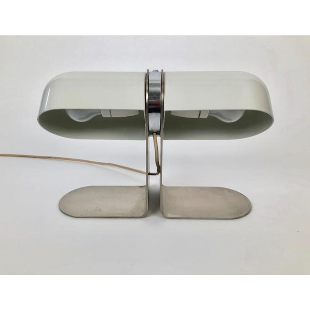 A rare table lamp designed by Andre Ricard for Metalarte in Spain, from the 1970 's. This all metal lamp consists of a...