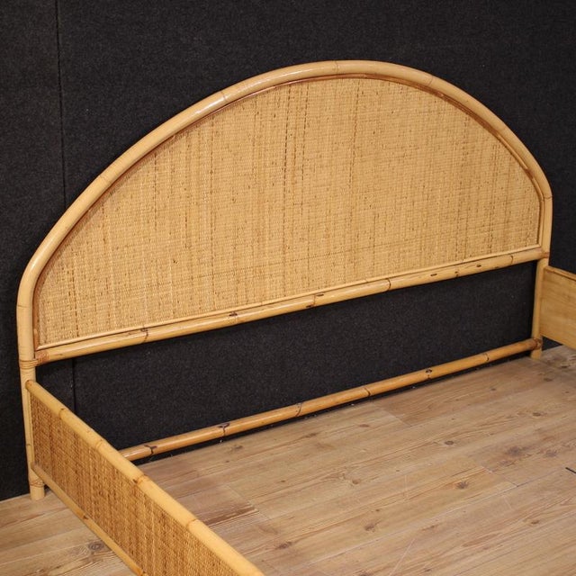 Italian double bed from the second half of the 20th century. A beautifully crafted bamboo bed with rattan decors of...