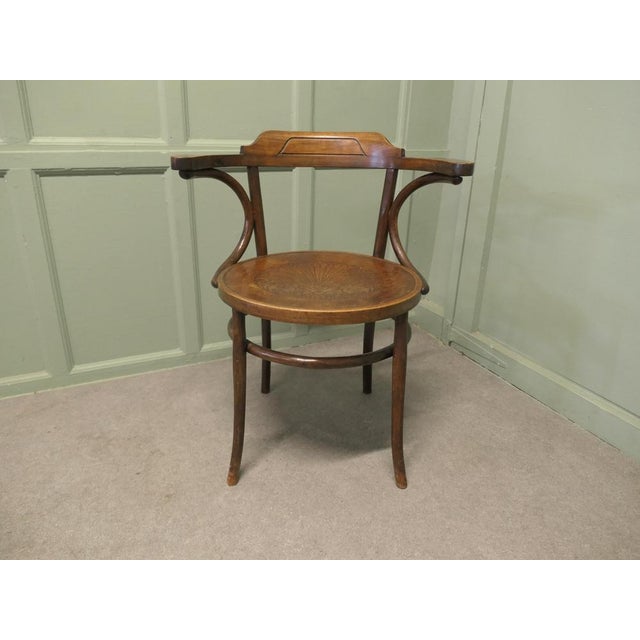 This is a rare and charming piece the carver chair is made in bentwood with a large pressed ply wood seat, the design is a...