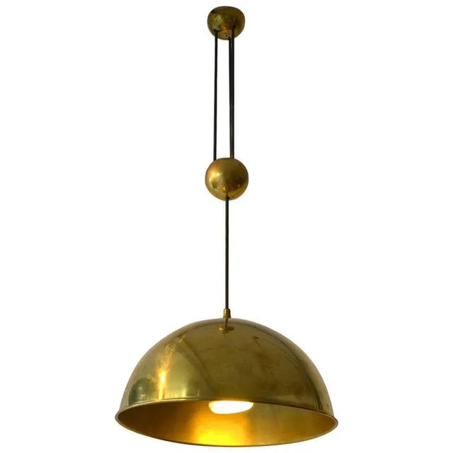 Counterbalance pendant 'Posa' by Florian Schulz side weight. Strong and minimal pendant in a high quality brass moves...