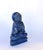 A finely hand-carved Buddha sculpture crafted from natural lapis lazuli. Buddha is seated in a dhyana asana upon a...