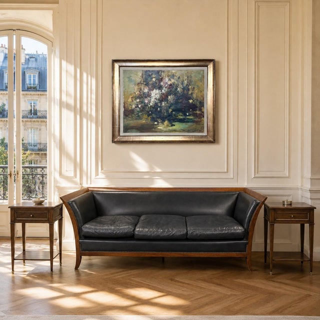 Refined Louis XVI style brings quiet neoclassical order to this pair of mid-century mahogany end tables, each crafted with...