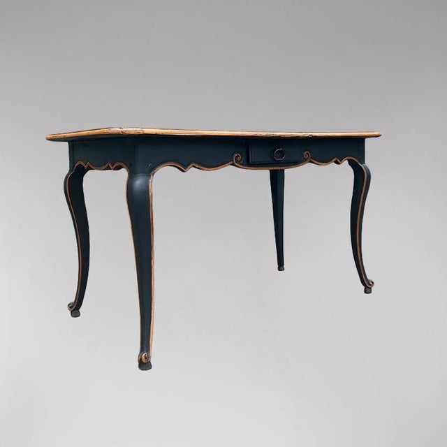 Console or writing table in patinated black wood, resting on four cabriole legs, with a drawer in the frieze. Louis XV...