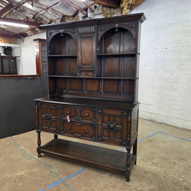 This Handsome Welsh Dresser With Carving, Beading, and Arch Details has a nice open potboard base. It has 2 drawers and 3...