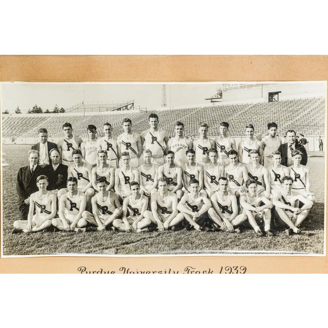 Step into the rich legacy of collegiate athletics with this striking antique framed photograph of the Purdue University...