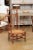 A rustic French cherry wood armchair from the late 19th century, with rush seat and sheaf back. Created in France during...