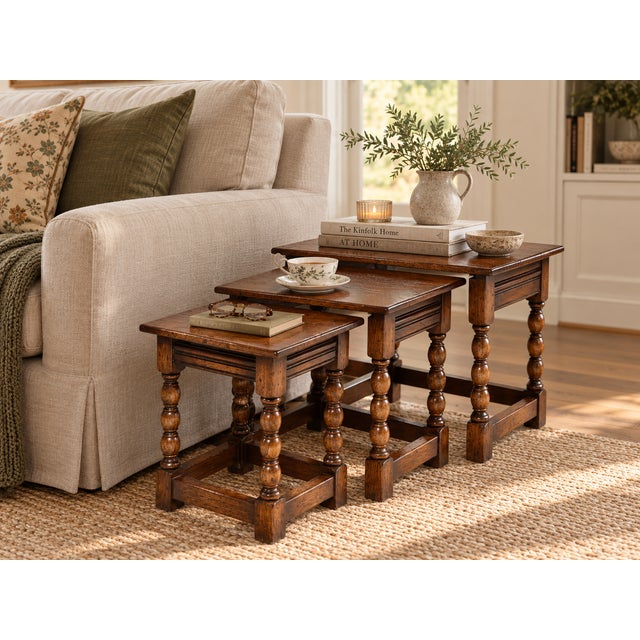 Three tables. One footprint. Very English. This antique British nesting table set is crafted in oak and designed so all...