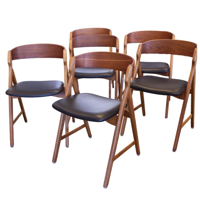A set of six magical chairs designed by Henning Kjærnulf for Boltinge Stolefabrik in Denmark. The chairs have a very cocky...