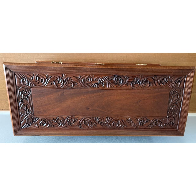 Exceptional hand-carved solid mahogany storage chest handcrafted in Kenya. This one-of-a-kind artisan piece features...