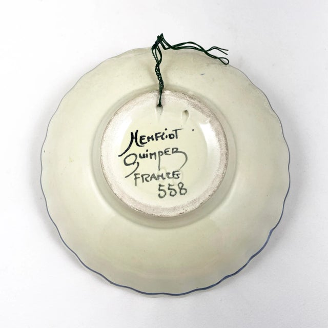 Beautiful vintage Henriot Quimper bowl with scalloped edge. The bowl is white ground, painted with Breton Woman, with...