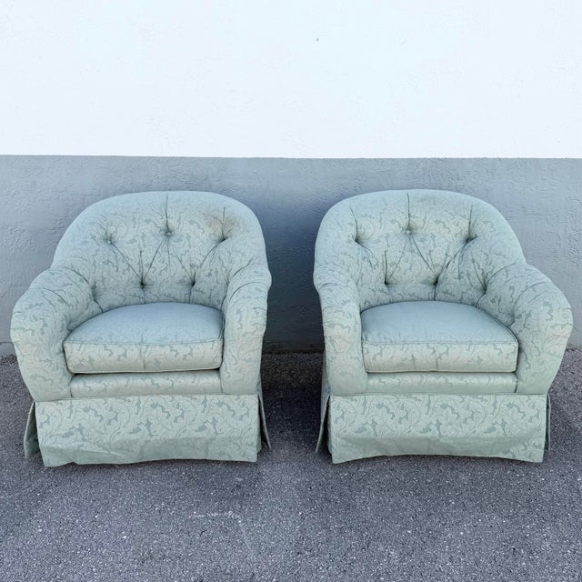 Elegant pair of vintage Ethan Allen club chairs featuring generously padded silhouettes and classic button-tufted backs....