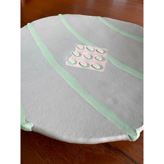 Unique hand built pottery plate in the Memphis post modern style. New wave feel with pastel colors and optical grid...