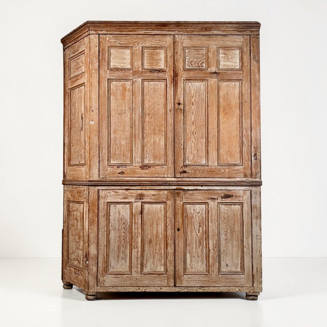 A superb and generously proportioned 19th century stripped pine housekeeper’s cupboard of exceptional character and...