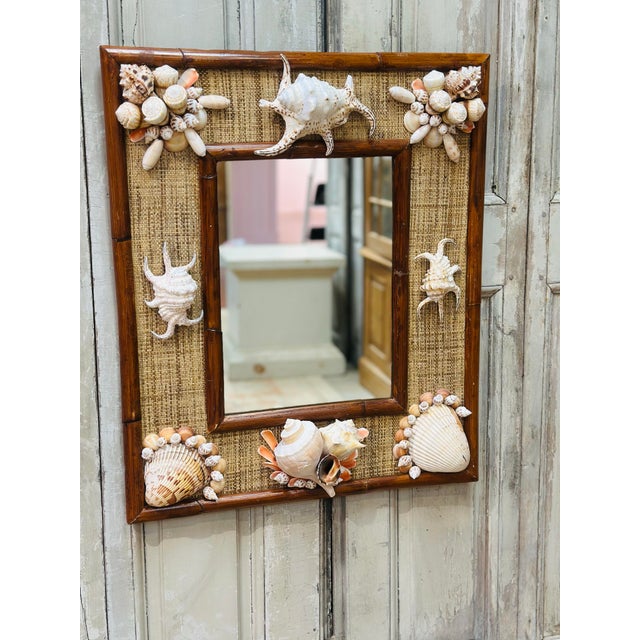 This vintage mirror has it all, rattan, cane and shells!