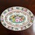 Offering a lovely Famille Rose Chinese export porcelain platter from the mid-20th century. This beautiful oval platter...