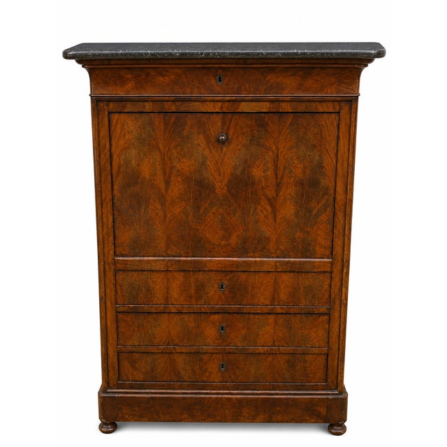 Louis-Philippe flame mahogany secretary desk (19th century). Magnificent veneer. Superb black marble top. Dimensions:...