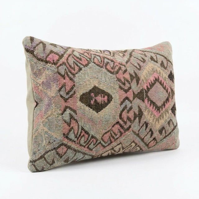 This beautiful 16'' x 24'' hand-woven Kilim pillow cover was made from an authentic Turkish kilim. The traditional flat-...