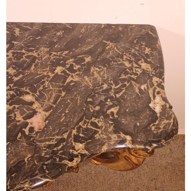 superb Louis XV period console in carved and gilded wood Beautiful console with an animated shape on the front and on the...