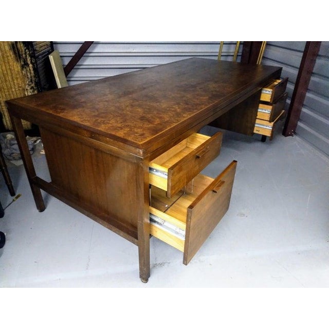 Jens Risom Executive Walnut desk with Carpathian Elm Burl Top 1990s Featuring 4 drawers and one file drawer. With casters....