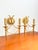 Pair of gilt brass wall sconces by gaetano sciolari, designed in a hollywood regency style and produced in italy. the...
