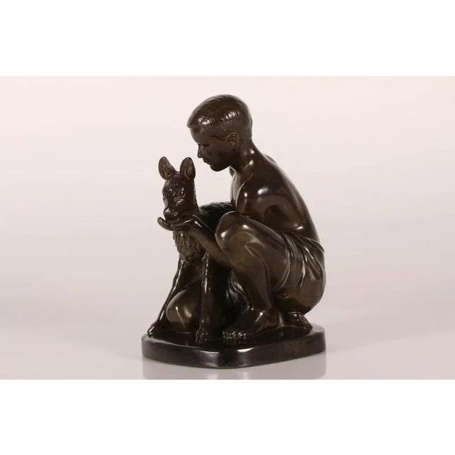 Original figurine designed by Danish artist and sculptor Just Andersen (1884-1943) featuring a young shepherd feeding a...