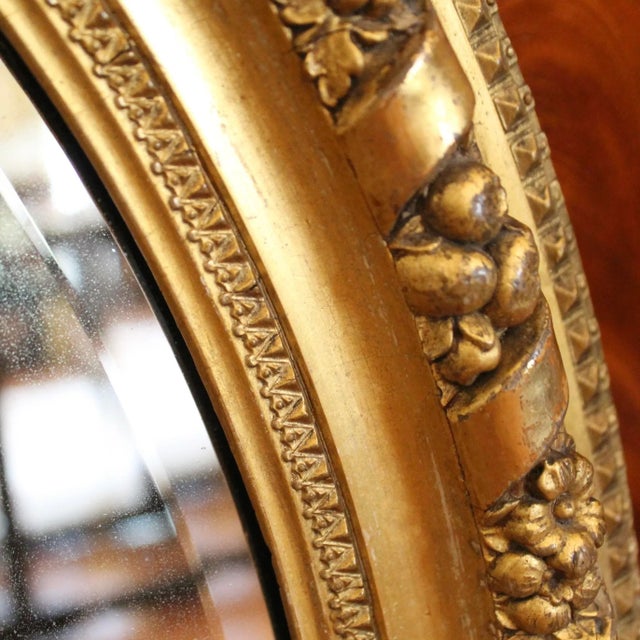 Oval Gilded Antique Mirror With Ribbon Scroll and Flowers | Chairish