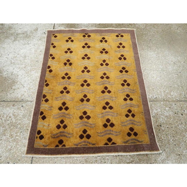 A vintage Turkish Anatolian Deco throw rug handmade during the Mid-20th century. Measures: 2' 7" x 3' 5"