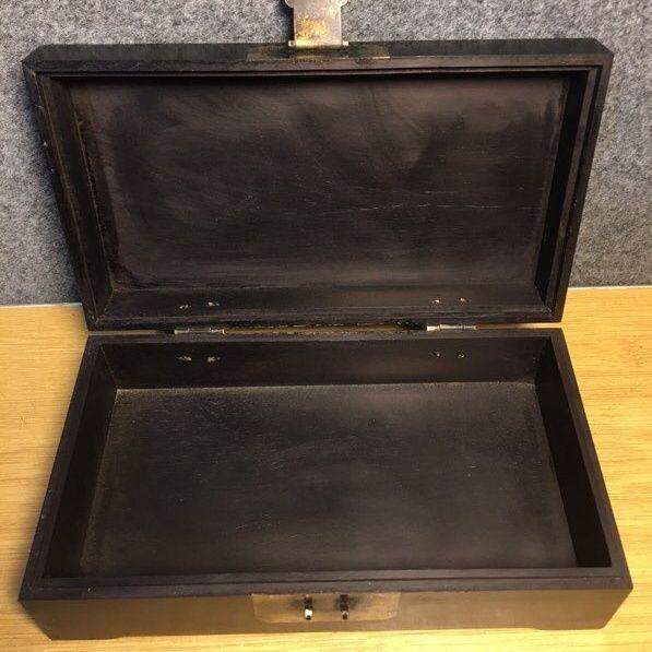 This beautiful rectangular box is crafted from dark, richly grained wood (resembling rosewood or zitan) and adorned with...