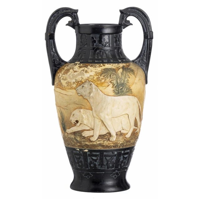 PAIR OF JARS Austrian, circa 1863. Ceramic with unglazed polychrome relief decoration depicting felines and floral motifs....