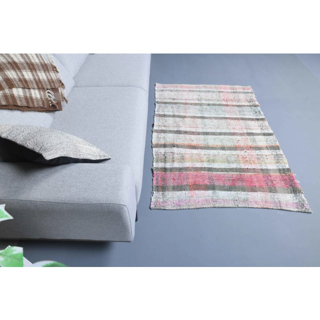 Vintage Turkish Hand-Knotted vintage rug is a semi-Vintage kilim area rug.'70s Eastern region of Turkey's unique rug is...