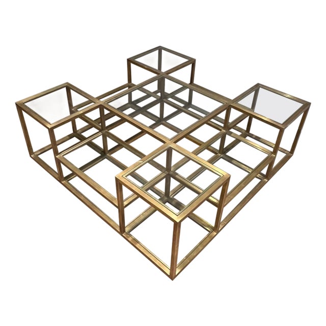 Large, multi-tiered brass coffee table. French work. Circa 1970 For Sale