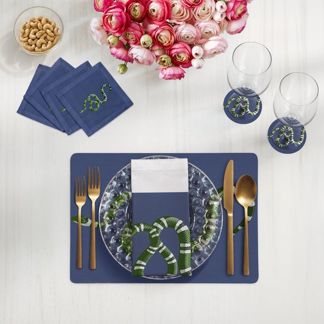 Let your table transition from classic to modern with our Serpent Vegan Leather Rectangle Pebble Placemat, featuring an...