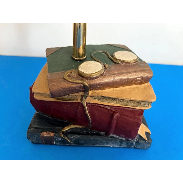 Chic petite 1970s trompe l'oeil accent lamp of painted and incised resin designed to look like a random stack of books...