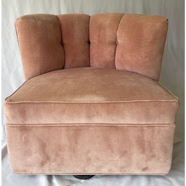 American Art Deco swivel club chair with curved channel back, button tufting and spacious seat for ultimate relaxation....