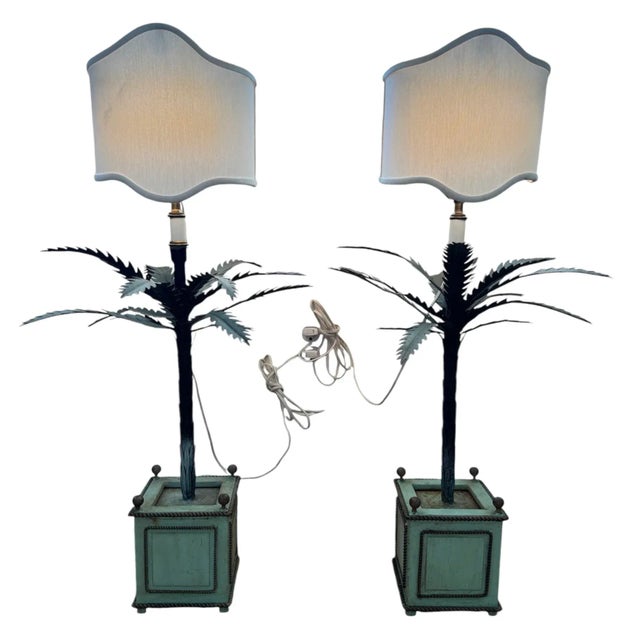 Italian tole potted palm trees. Originally candleholders. They now have an electrified top with shades to be used as lamps...