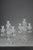 Pair of Baccarat four-light, two-tier crystal girandoles. They are decorated with geometric crystal pendants, the shafts...