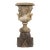 Neo-Classical Style Cast Stone Garden Urn on Pedestal With Bacchanalian Relief For Sale