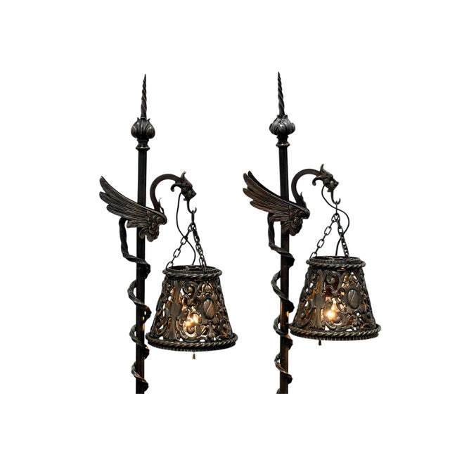 These are surprisingly small at just over 4' tall! Solid cast in bronze, including the shade. We suspect they were...