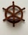 This pair of vintage wooden ship wheel wall shelves feature a classic nautical design, each crafted in the form of a six-...