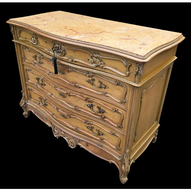 This Early 20th Century Galliy Bassani French Rococo/ Louis XV Style Marble-Top Commode,crafted in Buenos Aires is a...