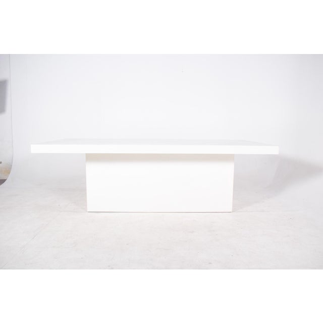 This impressive dining set, dating from the early 2000s, consists of a large rectangular table and eleven robust chairs....