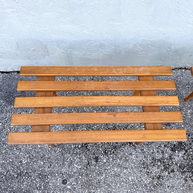This pair of mid century modern slatted benches showcases the clean, functional design that defined the era. Each features...