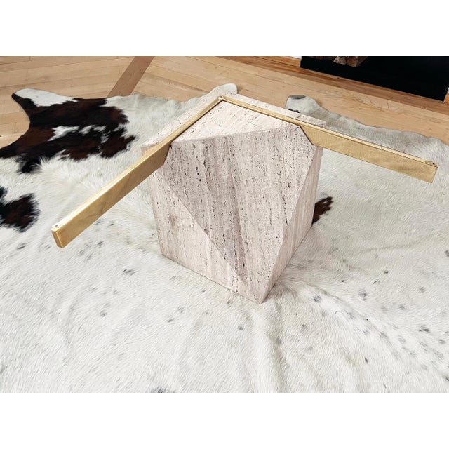 Fabulous and extremely iconic Attributed to Artedi Travertine and brass coffee/ cocktail table. This sought after version...