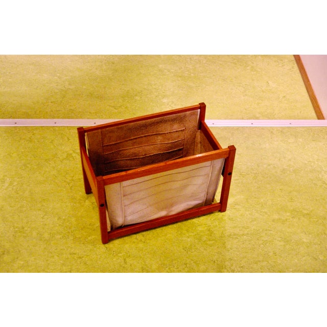 Attractive teak and leather magazine rack with a clean design and warm colors, in good used condition. I have official...